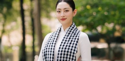 Lương Thuỳ Linh diện áo dài trắng đeo khăn rằn